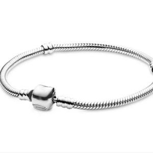 Silver charm bracelet with barrel heart lock. 20cm